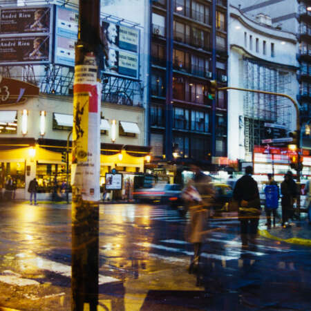 <p>A view shot from a prized window seat in a café along Buenos Aires' Avenida Corrientes. Despite the blustery weather, the avenue is still animated. Across the street is Café La Paz, something of an institution (still operating, but since remodeled away from this 90s po-mo look).</p>