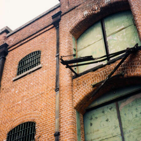<p>The gentrification of Buenos Aires' Puerto Madero district had not reached very far in the late 1990s. The now-prized warehouses were in various states of dereliction at the time, like this one.</p>