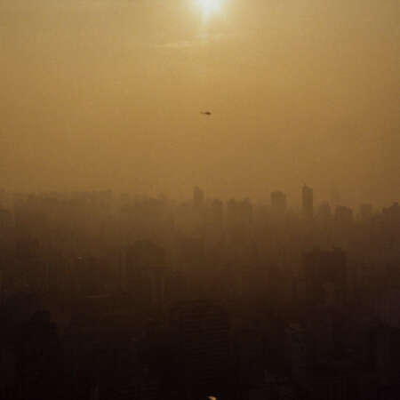 <p>A helicopter whisks a VIP over the endless skyline of São Paulo during one of its whiskey-hued afternoons. There's no place quite like this city.</p>