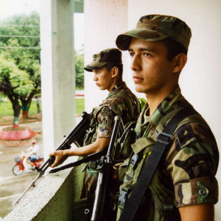 <p>Two soldiers on sentry duty in Tame, Arauca. Both men were part of Colombia's 'Soldados de mi pueblo' initiative, which inducted locally born men into military service in their own communities in an attempt to bolster security. </p>
