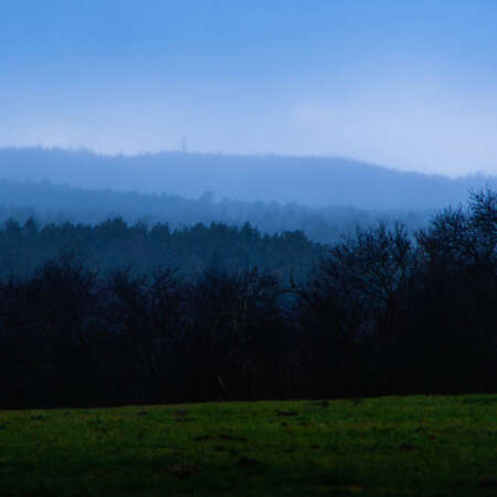 <p>Faint snow falls over rolling hills in the Märkische Schweiz region.</p>