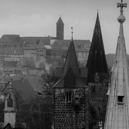 <p>A view of spires and towers in Quedlinburg on a winter's day.</p>
