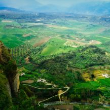 <p>A view over farm fields from the impressive clifftop town of Ronda, in Andalucia.</p>