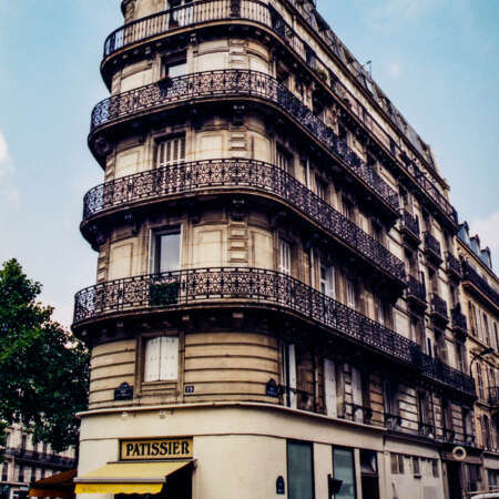 <p>A patisserie takes pride of place on a Parisian corner.</p>