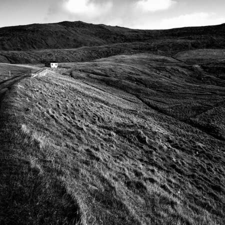 <p>A solitary cabin in the pastures near Í Botni, on the southernmost island of the Faroes. </p>