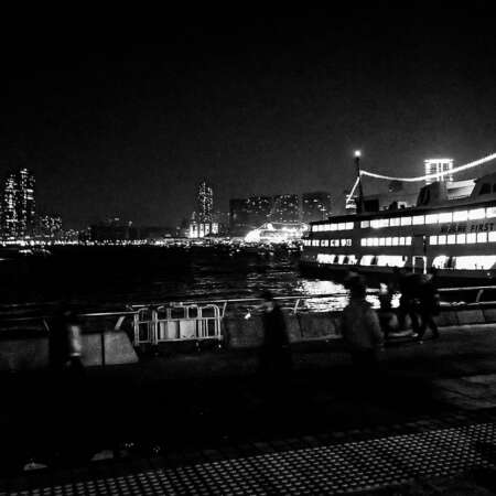 <p>Hong Kongers rush along the waterfront shortly before midnight on New Year's Eve 2013.</p>