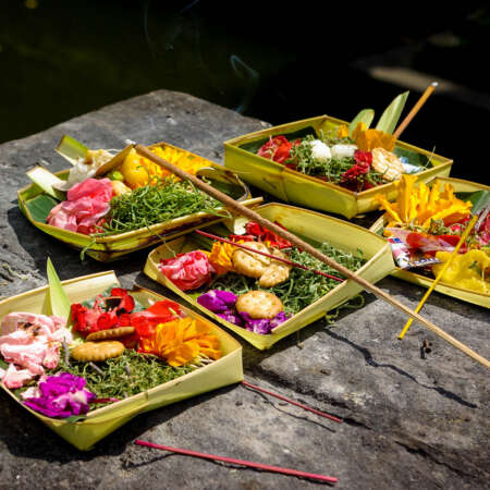 <p>Balinese Hindus create these colourful <em>canang sari</em> baskets from palm leaves. They are left at temples, in front of homes, and in many other places as daily offerings.</p>