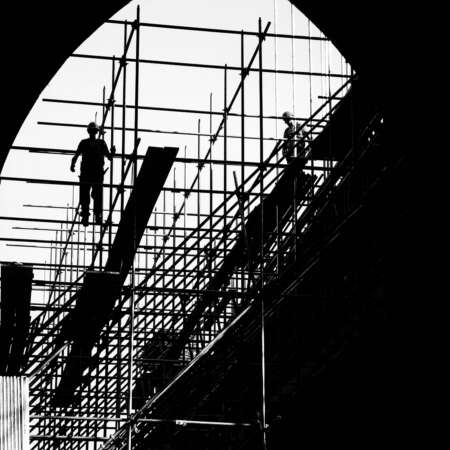 <p>Builders on a scaffold working on restorations in the Rock of Cashel complex.</p>
