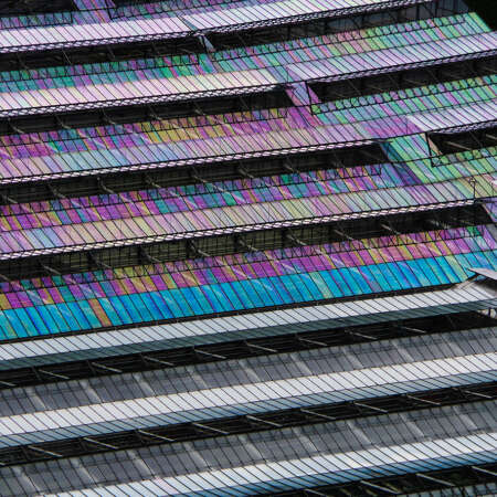 <p>Greenhouses form an abstract pattern in a valley more than a stone's throw away.</p>