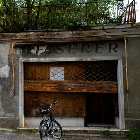 <p>Signs of life at a storefront that's seen better days.</p>