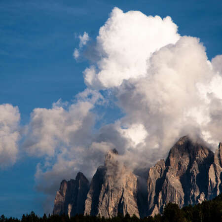 <p>In the local Ladin language, these peaks are called Odle (needles), which does describe their steep, sharp peaks – here partly obscured by clustering clouds.</p>