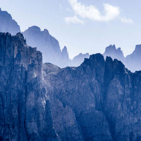 <p>A telephoto shot of the face of some of the lesser Dolomite peaks, with the Odle group in the distance.</p>