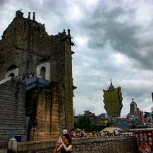<p>A woman turns her back on the visitors clogging the steps of Macao's landmark Igreja de São Paulo ruins and the skyline of casino towers to capture her own take on the densely populated city.</p>