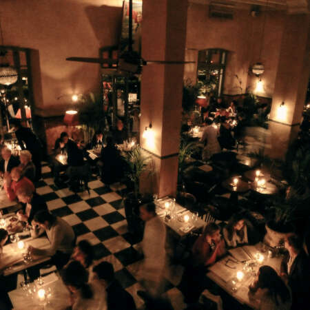 <p>A glamorous old café bustles by night.</p>