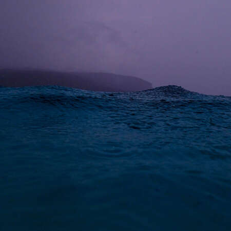 <p>A wave looms during afternoon showers in the waters off Jaco. </p>