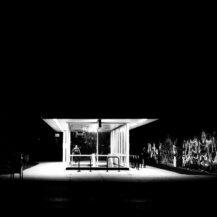 <p>Commuters emerge from one of Chicago's metro stations into a dark night.</p>