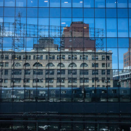 <p>The subway and some skyline reflect in the mirrored windows of new office blocks in Queensboro Plaza.</p>