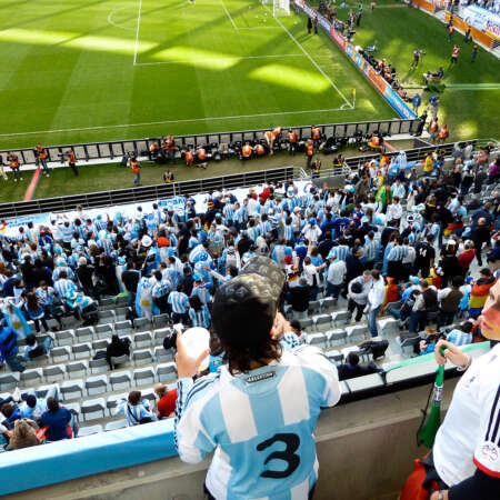 <p>A German fan is slightly outnumbered by Argentine hinchas before their quarter-final match in the 2010 World Cup. The match ended 0-4 to the Germans.</p>