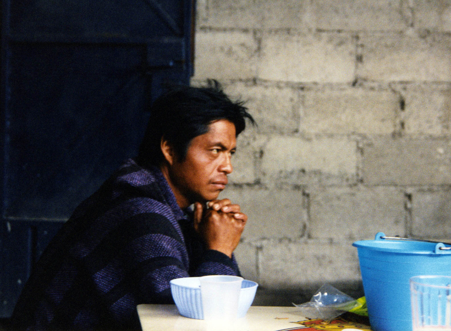 <p>A man thinks while drinking pulque, a traditional Mesoamerican indigenous drink made from the maguey plant.</p>